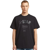 Man wearing a black t-shirt with 'G-Star' branding on a white background