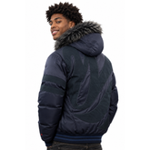 A man wearing a dark navy puffer jacket with a gray faux-fur hood trim, shown from a three-quarters back view against a white background.