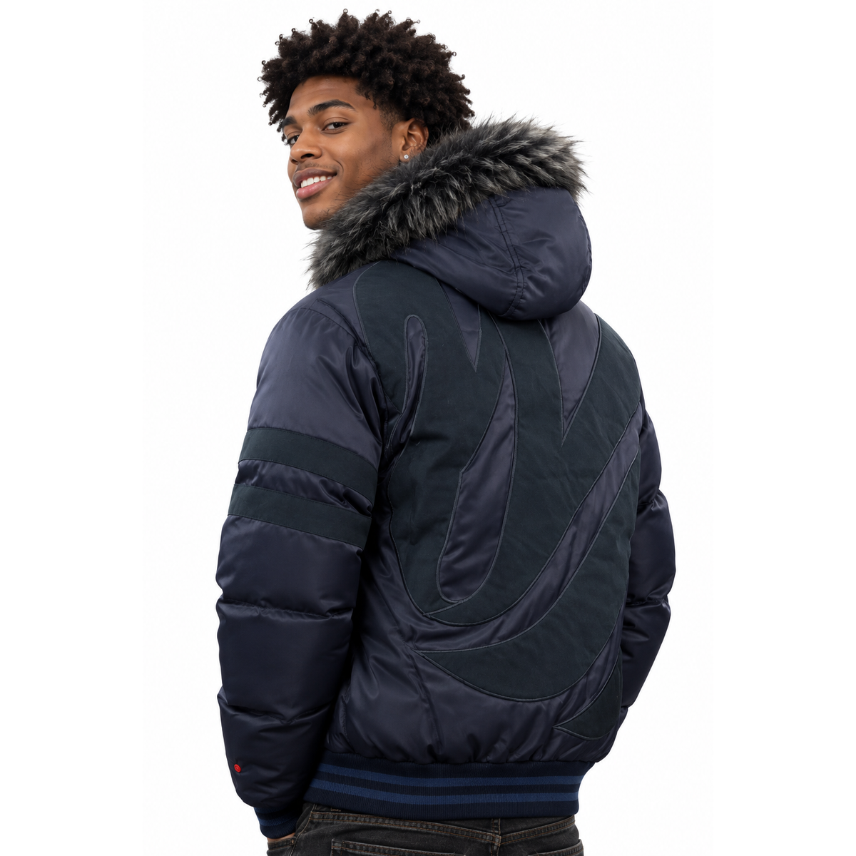 A man wearing a dark navy puffer jacket with a gray faux-fur hood trim, shown from a three-quarters back view against a white background.